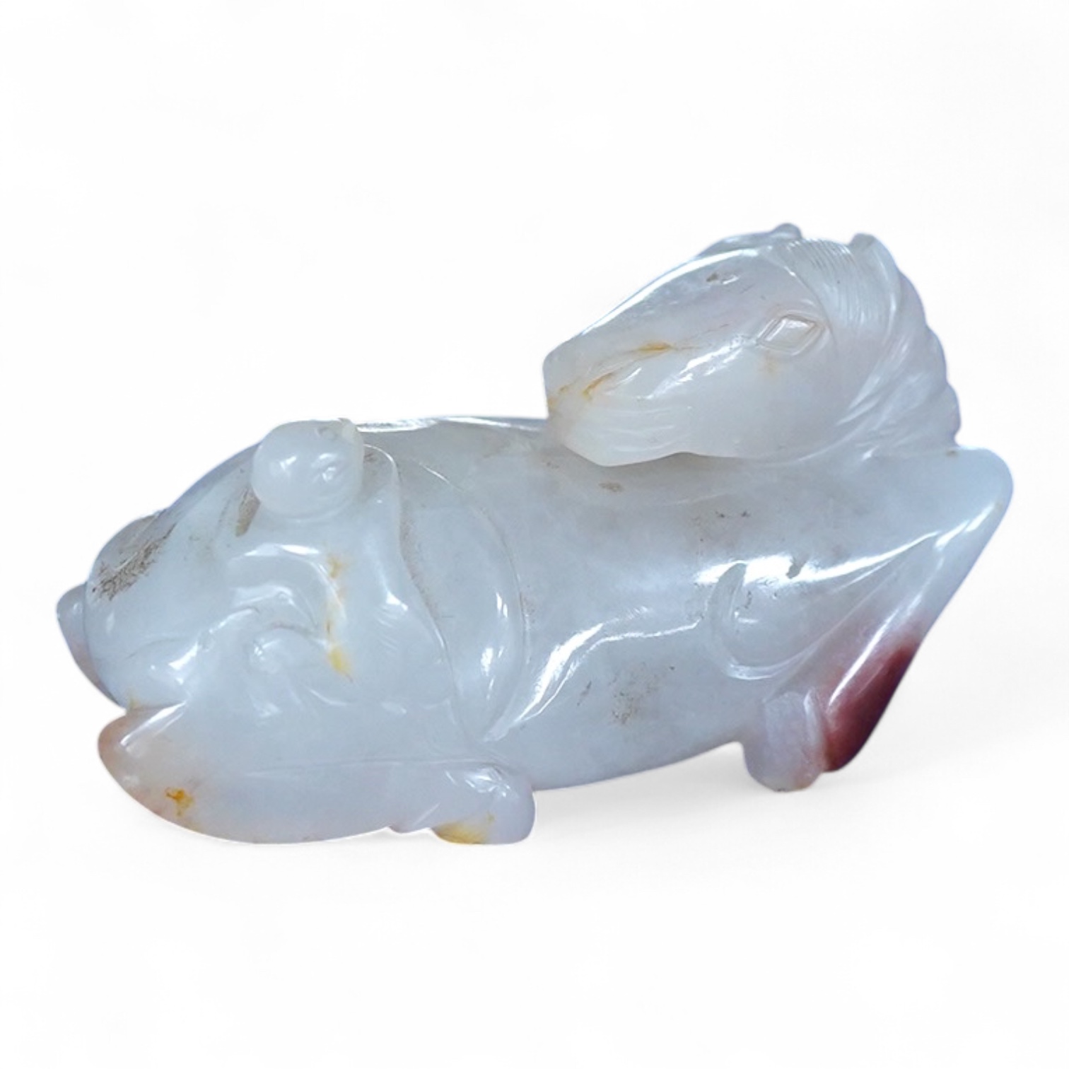 A Chinese agate carving of a horse and monkey, 8cm wide